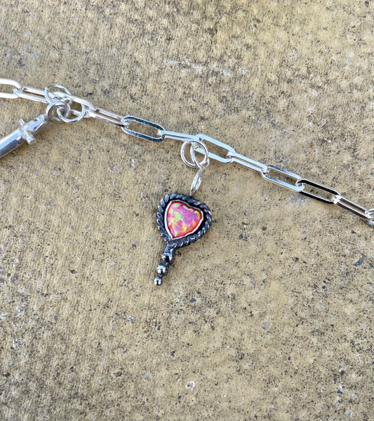 Bleeding heart charm