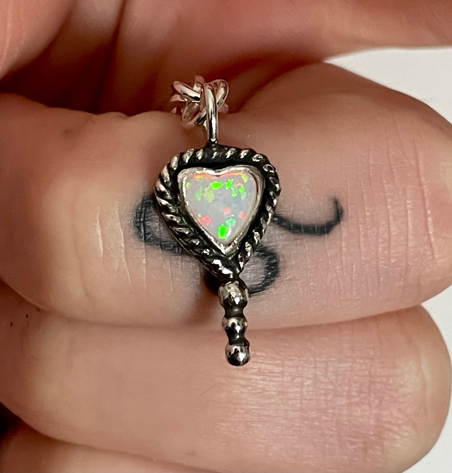 Bleeding heart charm